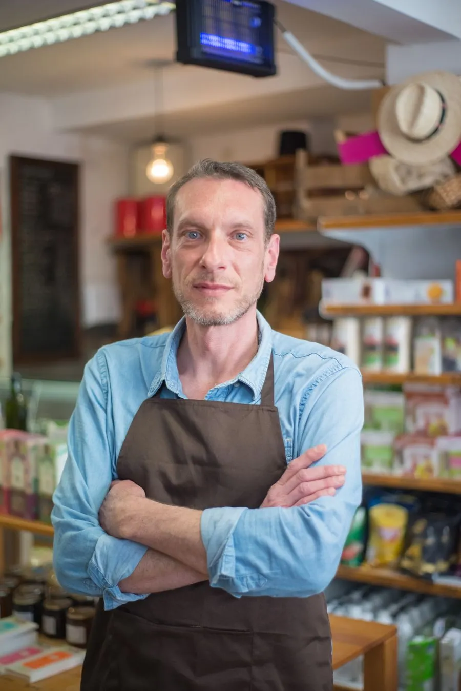 Small-business owner standing in their shop